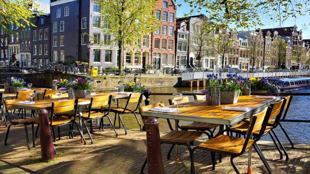 cafe near canal in amsterdam